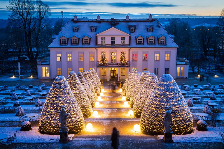 A view of Schloss Wackerbarth, shining in festive light during the "Winter Magic" event.